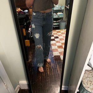 Custom destressed cinch bronze label jeans